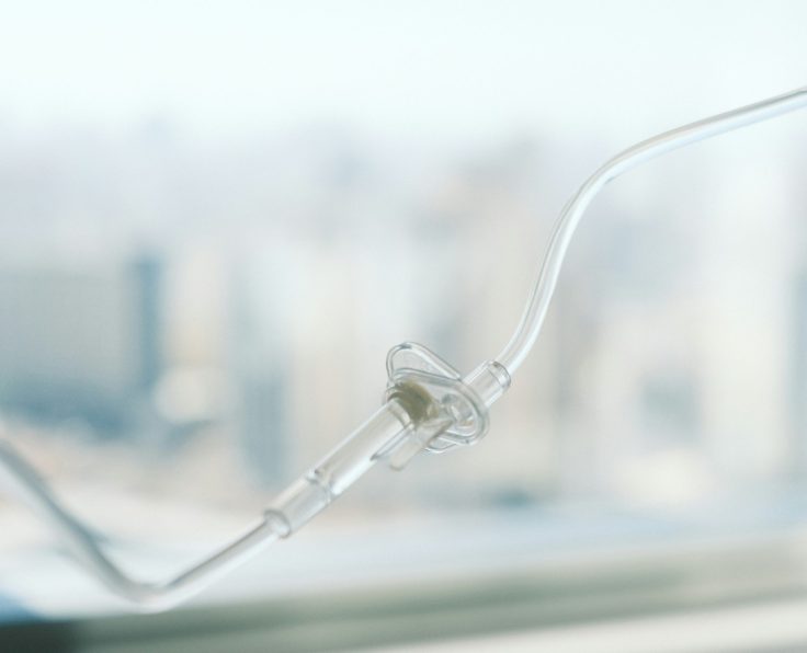 A image of an infusion line in front of a blurred image